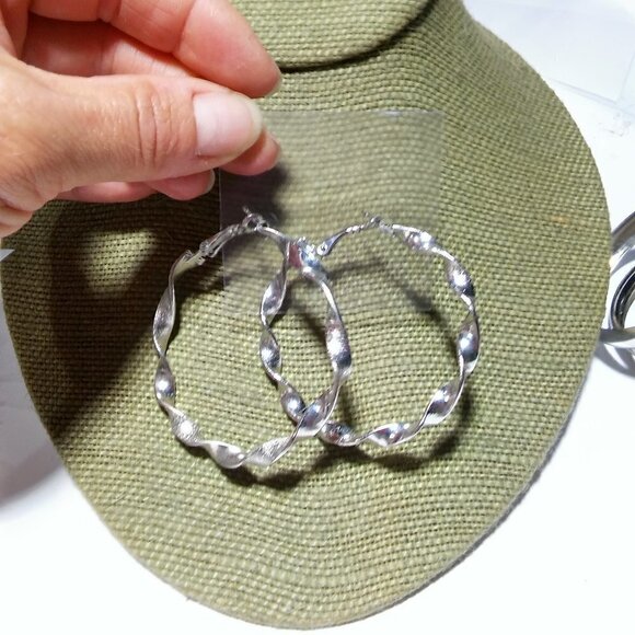 Jewelry - Women`s silver tone twist hoop earrings. 2 1/4 inc